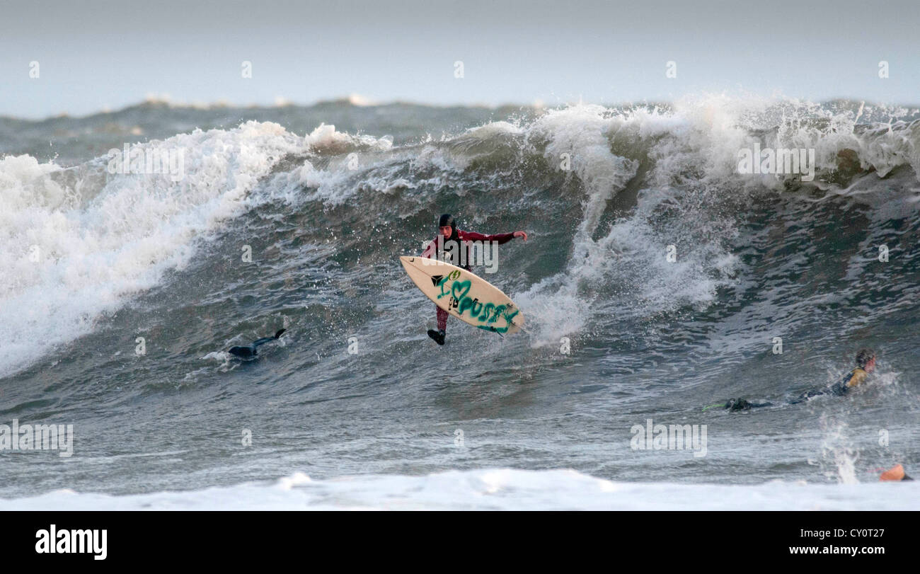 Surfer Falling Off A Large Wave At Langland Bay Near Swansea Stock