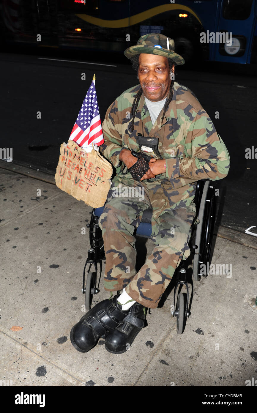 homeless-african-american-us-veteran-sitting-in-wheelchair-begging-CYDBM5.jpg