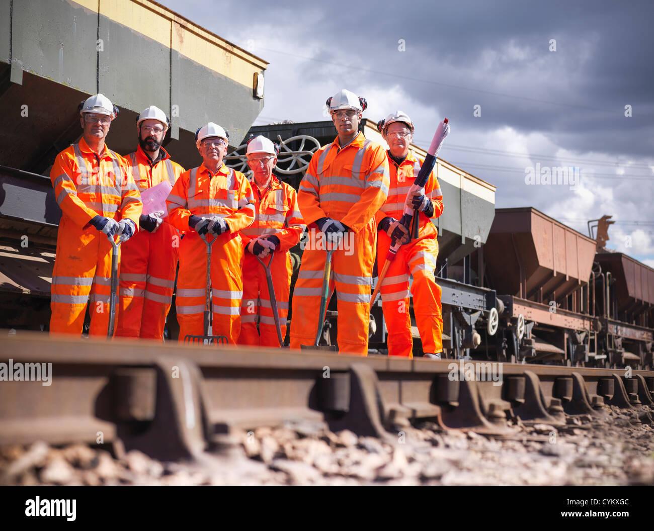 Railway workers standing on train tracks Stock Photo, Royalty Free