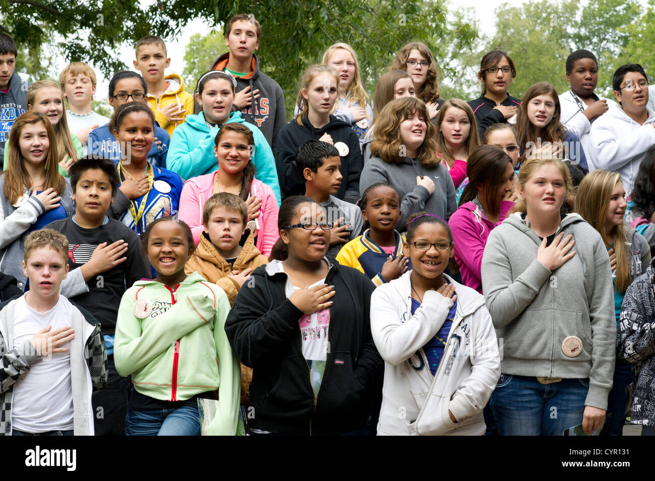 Multicultural group of Texas junior high school students recite Stock