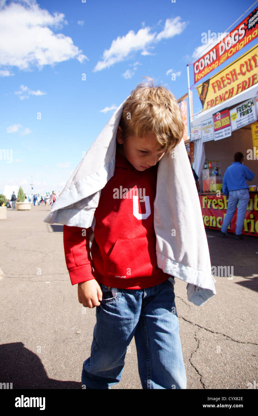 youn boy child kid head down walking dejected lonely alone afraid Stock