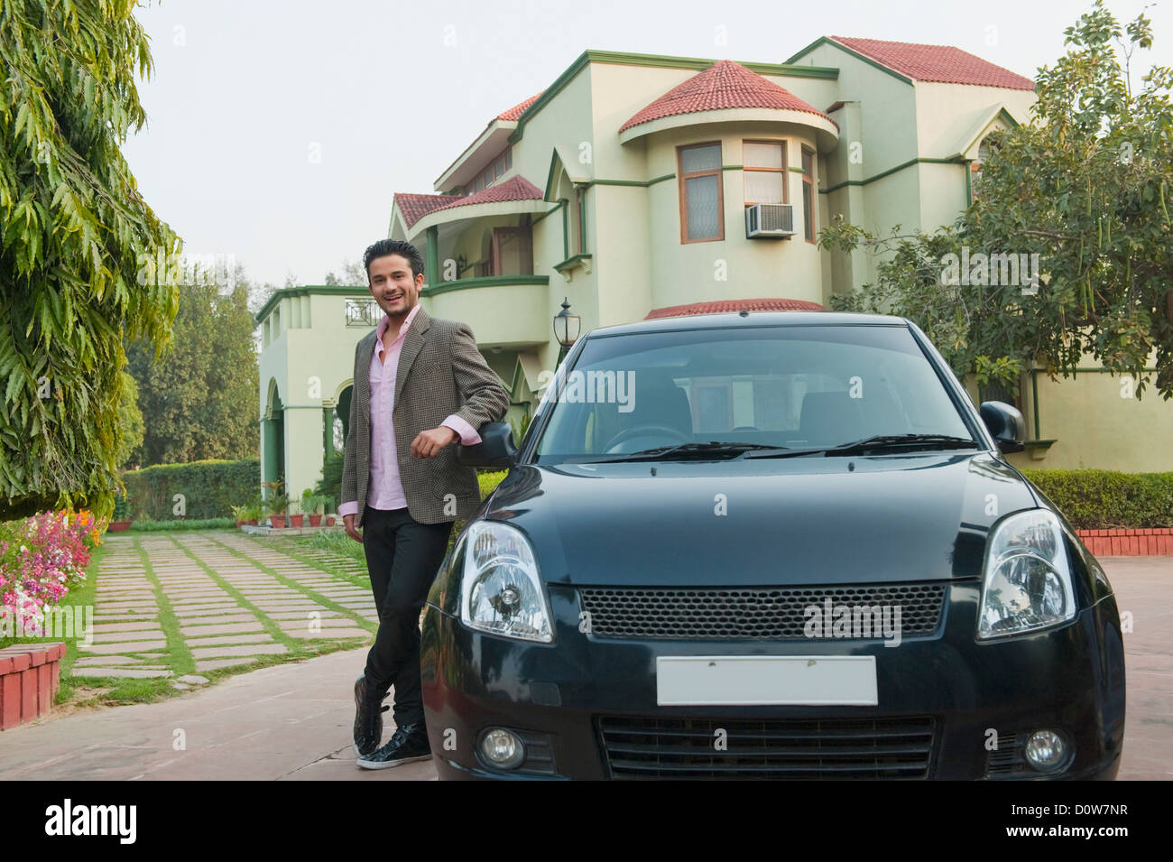 Man standing beside his new car Stock Photo, Royalty Free Image