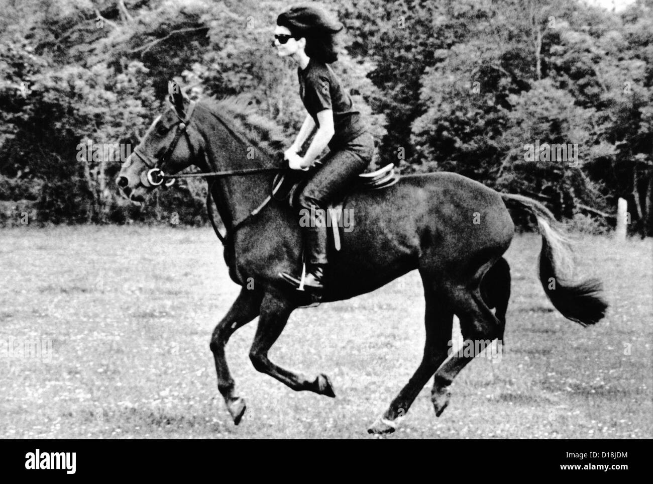 Jacqueline Kennedy, riding a horse in Waterford, Ireland where she
