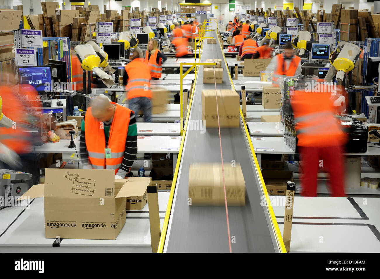 People work in the shipping department in the Amazon Logistics Center