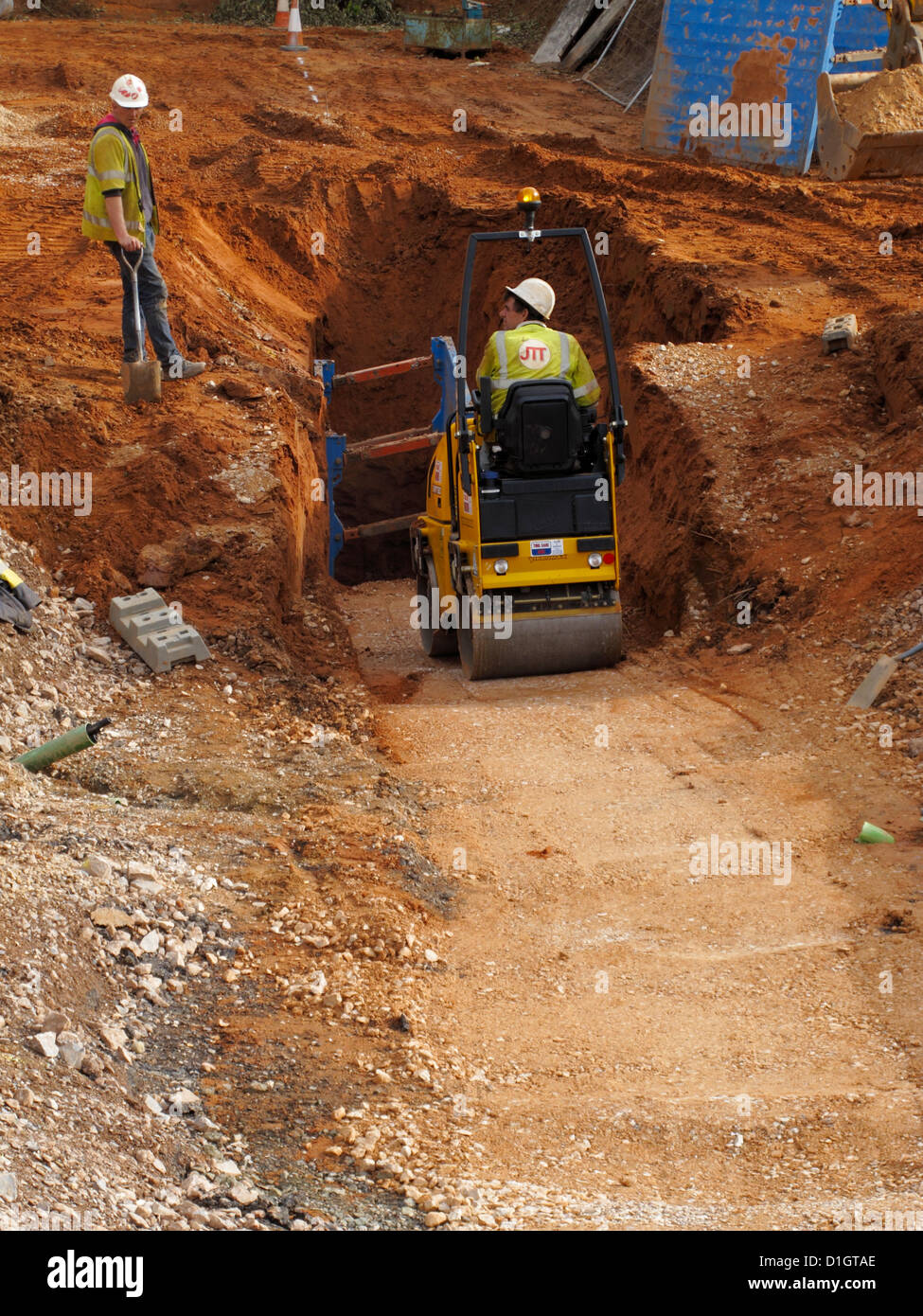 Small roller compacting compaction of fill soil backfilling trench