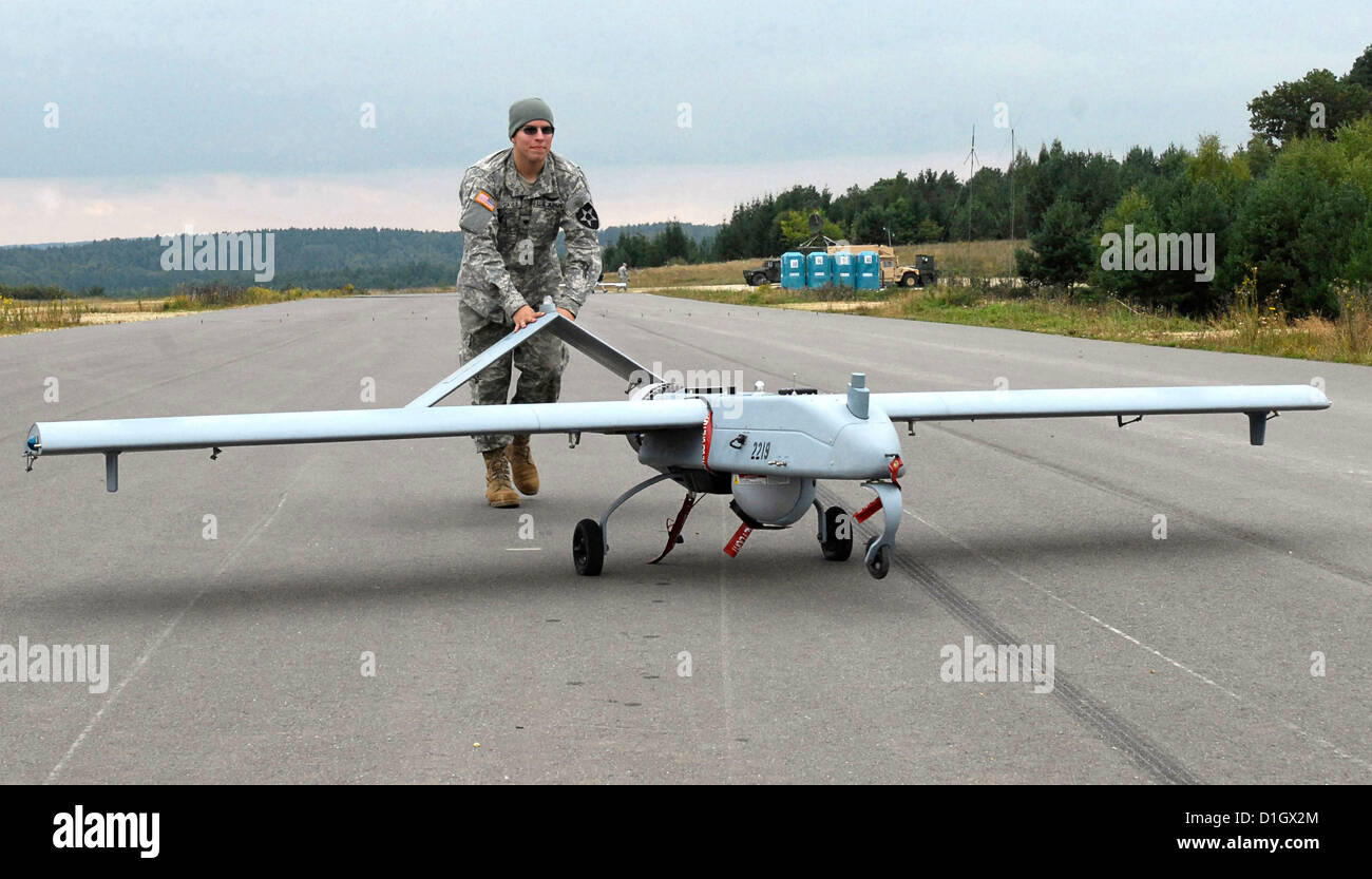 An Army unmanned aerial vehicle operator pushes a Shadow UAV down the Stock Photo, Royalty Free
