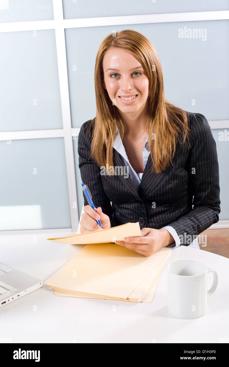 Business Woman Holding Legal Documents In Modern Office Stock Photo Alamy