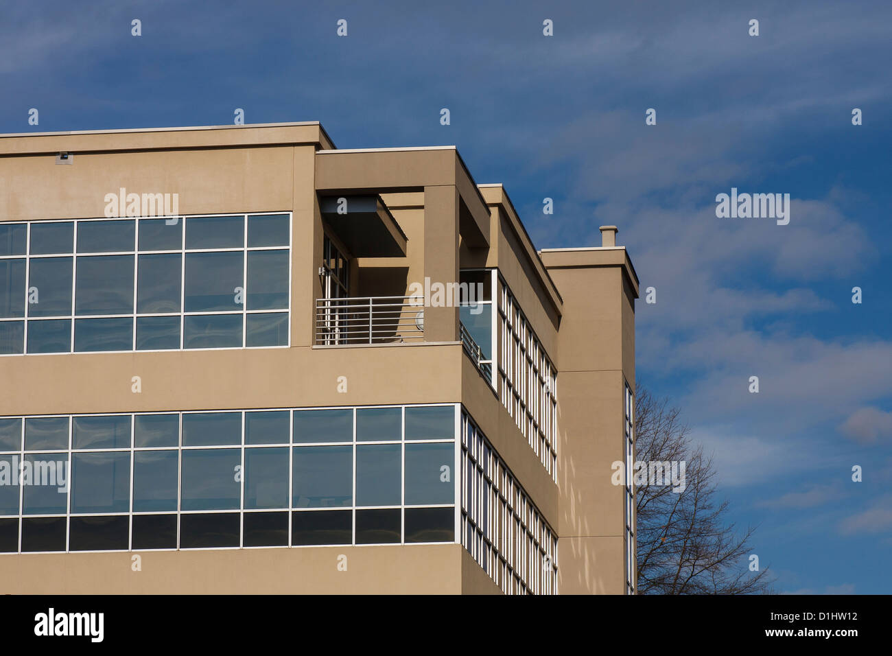 a modern stucco and glass office building with silver chrome trim a modern stucco and glass office building with silver chrome trim