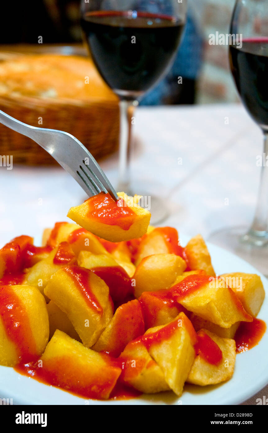 Spanish appetizer patatas bravas serving, close view. Madrid, Spain