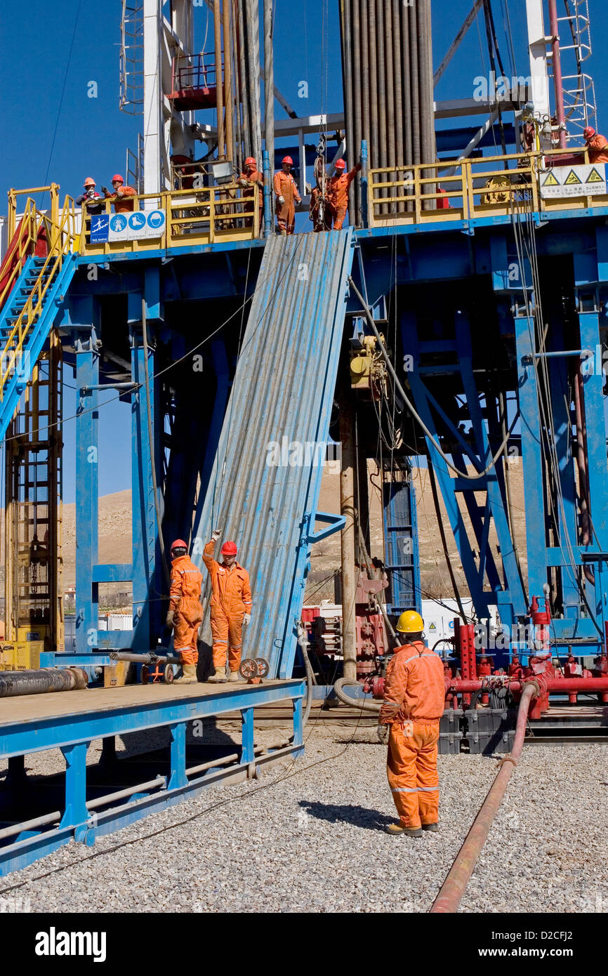 Onshore oil and gas exploration site. Making up wire line logging Stock