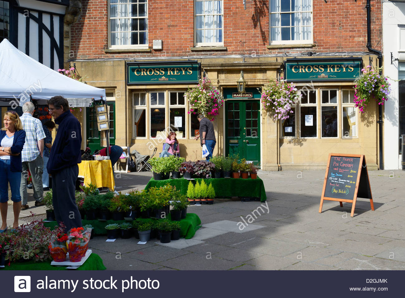 Market stalls outside the Cross Keys pub, Cheap Street, Sherborne Stock