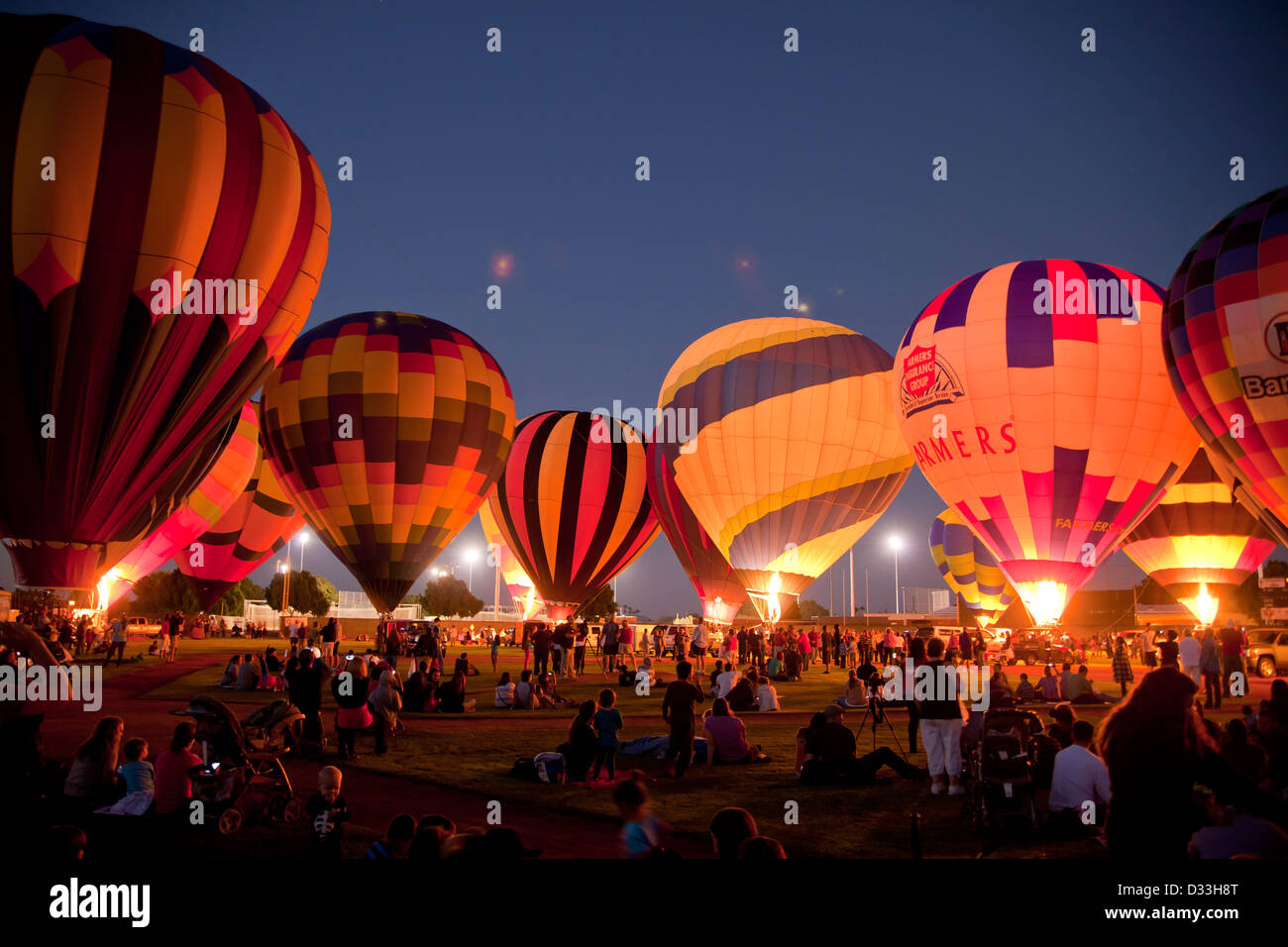 Hot Air Balloons glowing in the dark at t he Yuma Balloon Festival in