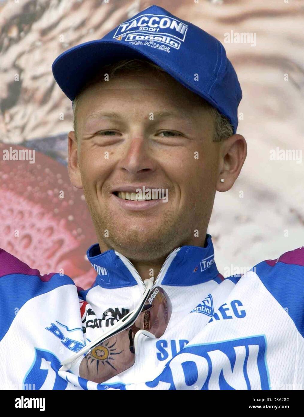 (dpa) Dario Frigo of the Italian Tacconi team celebrates his Stock
