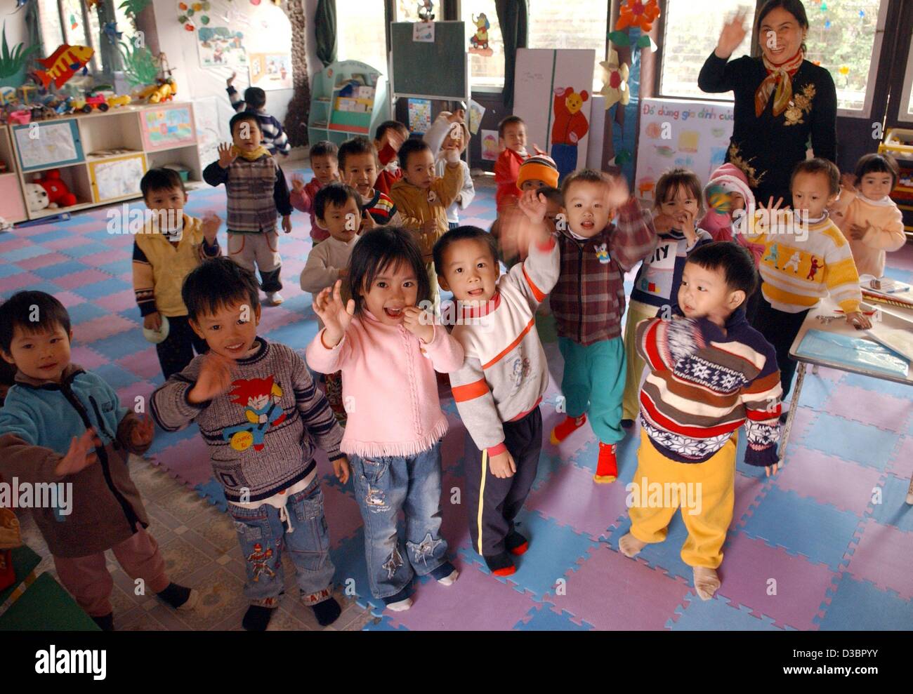 dpa small children and their teacher smile and wave at the sos childrens village in hanoi vietnam december 2004 four sos childrens villages opened - Small Childrens Images dpa small children and their teacher smile and wave at the sos childrens village in hanoi vietnam december 2004 four sos childrens villages opened - Small Childrens Images
