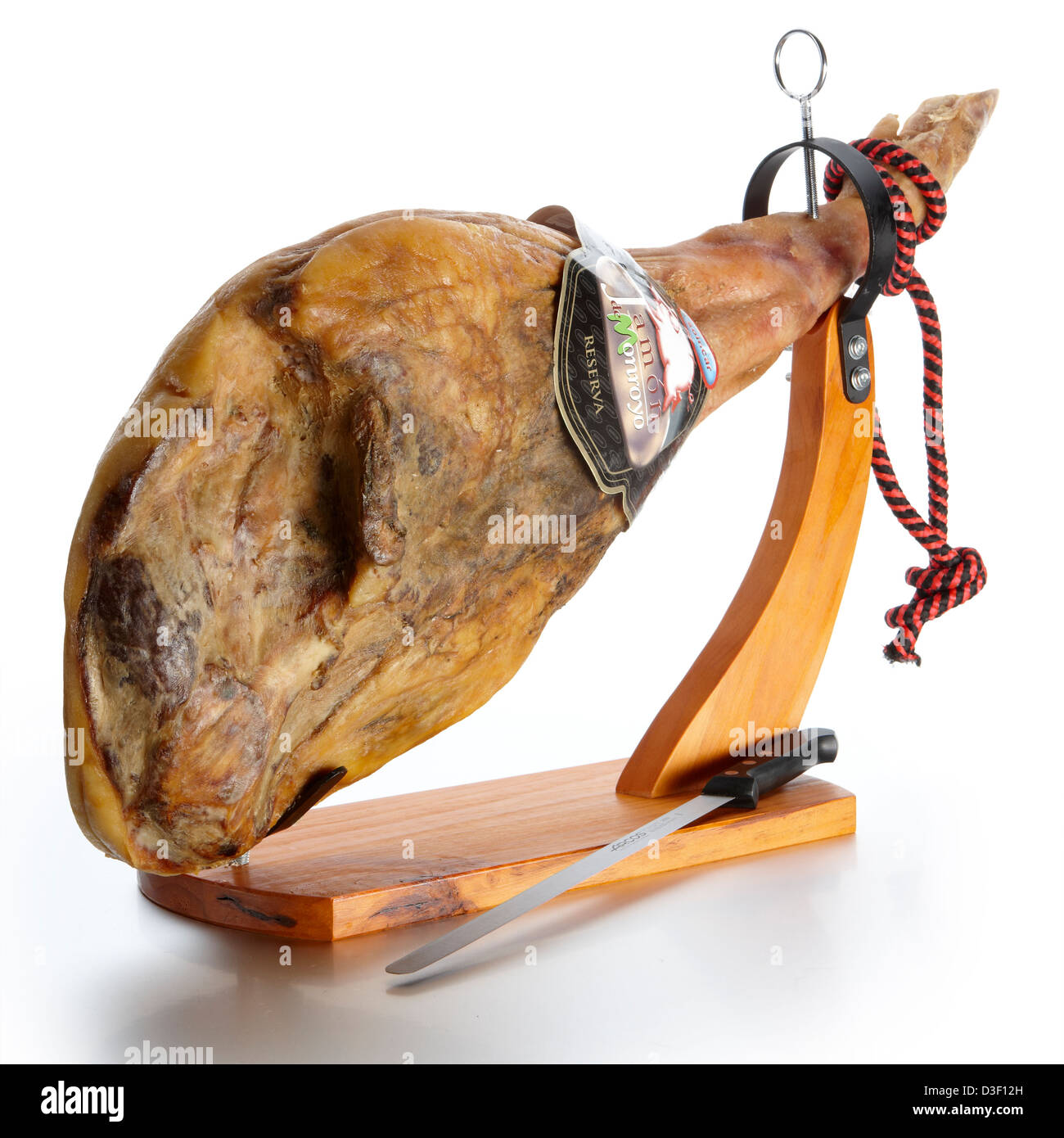Whole Serrano ham on stand with knife Stock Photo, Royalty Free Image
