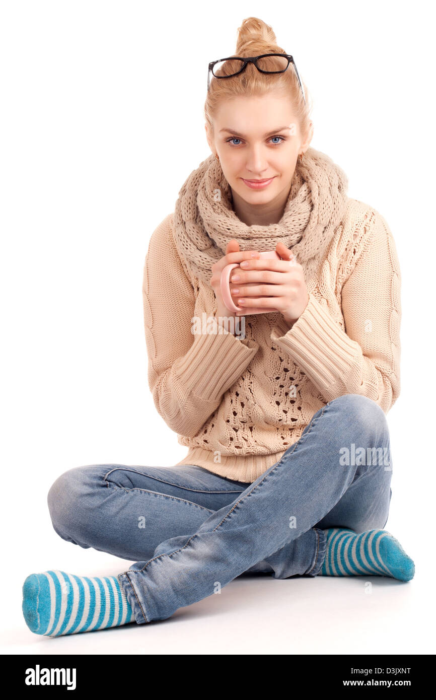 Blond Woman Holding Cup Of Hot Drink Stock Photo Alamy