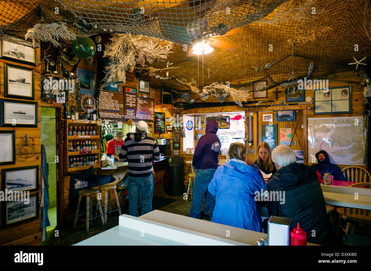 Visitors dining inside the Swiftwater Seafood Cafe, Whittier, Alaska