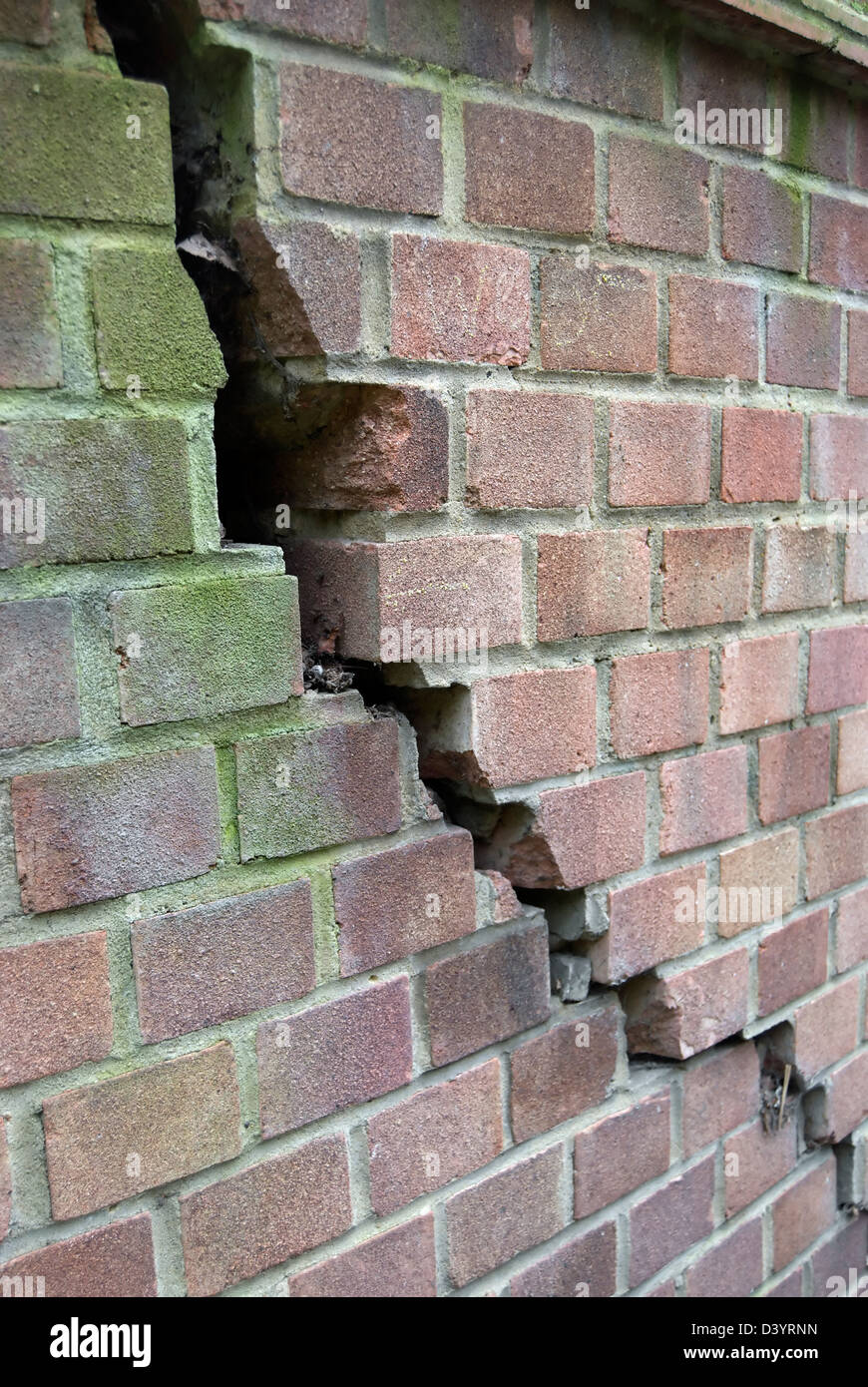 brick wall with large crack, presumably caused by subsidence Stock