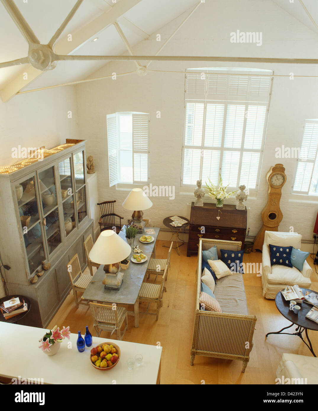 Small loft conversion with view from mezzanine of regency sofa and ...