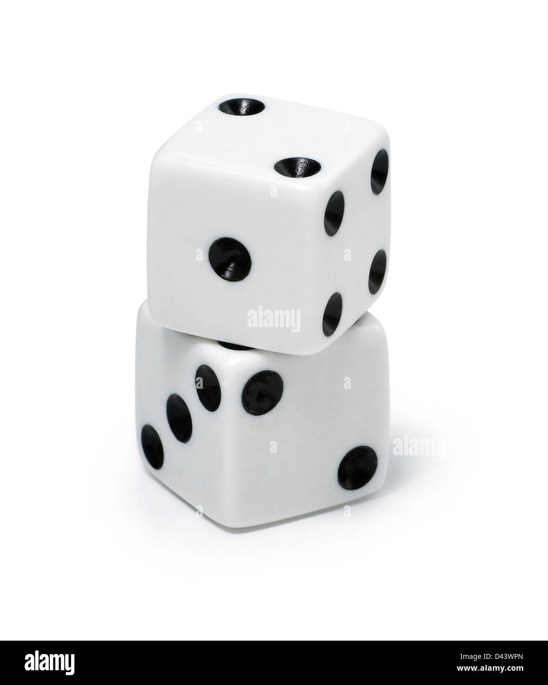 Two dice stacked on top of each over cut out white background Stock