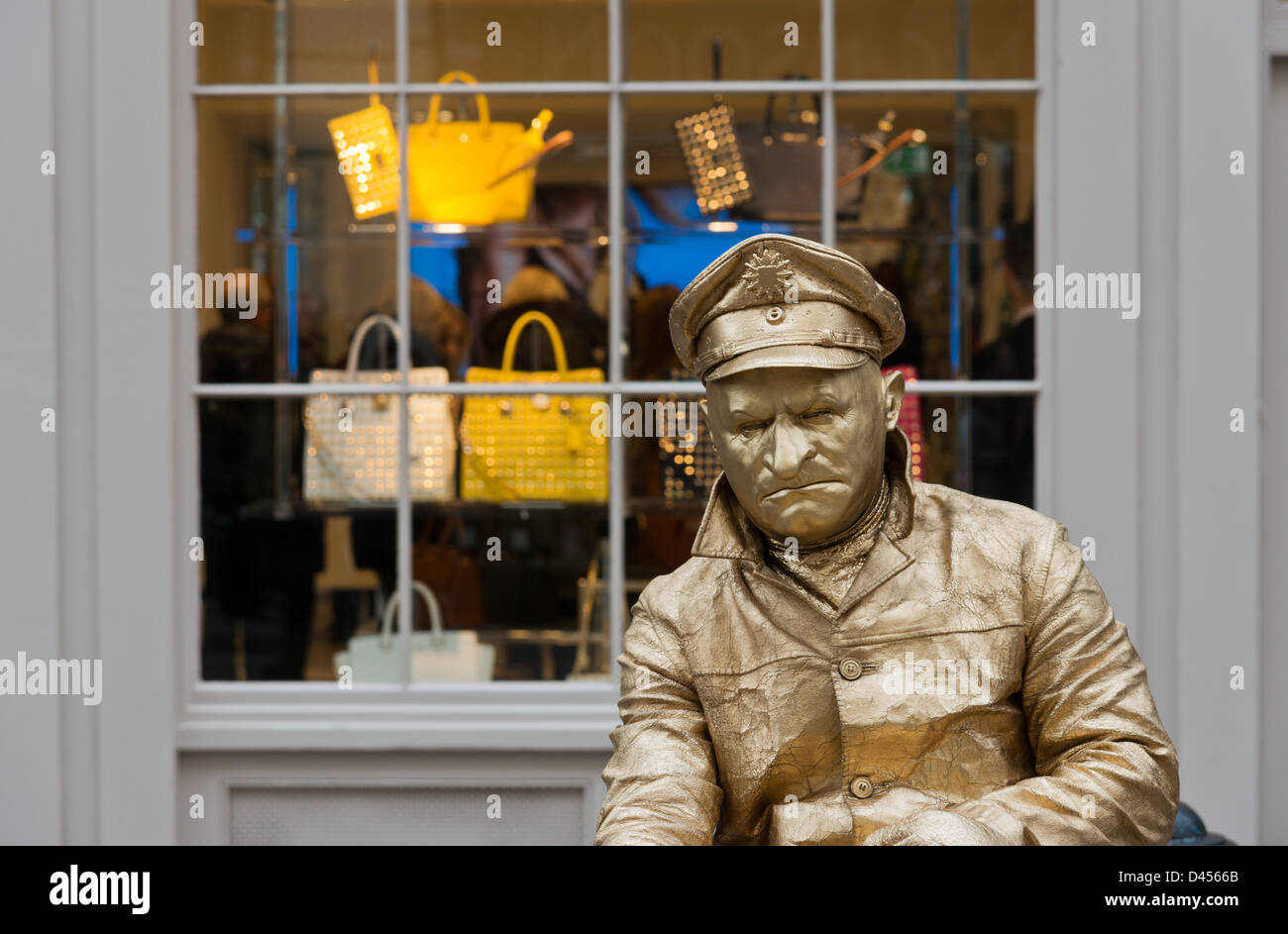 Gold painted male mime artist by a shop window Covent Garden ... Gold painted male mime artist by a shop window Covent Garden ...