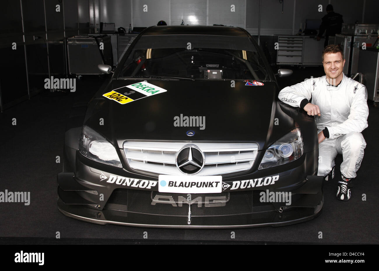 Ralf Schumacher Poses Next To A DTM Mercedes At The Race Track In