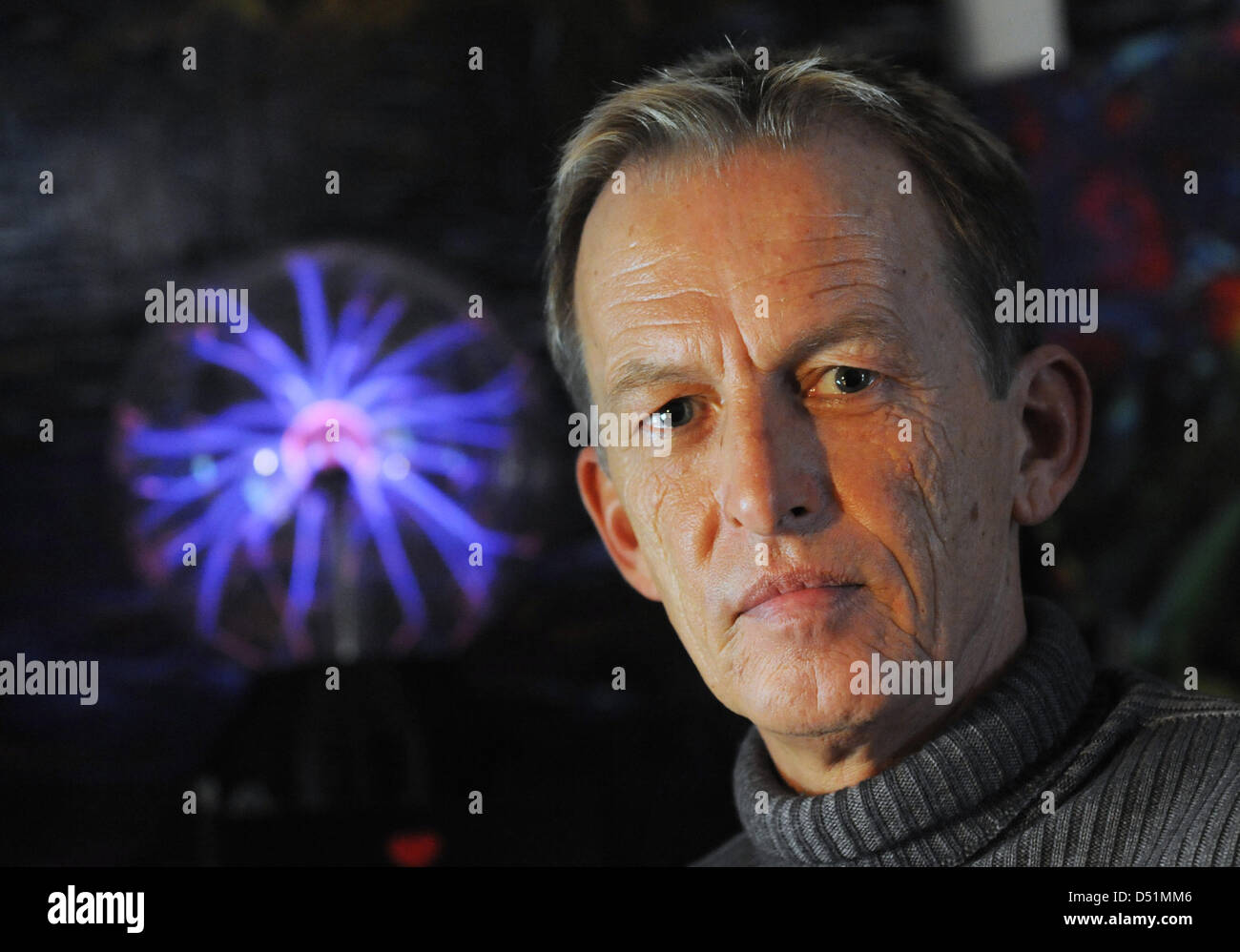 Astrologist Alexander Kopitkow poses with a plasma lamp in Filderstadt, Germany, 21 December 2010. He predicts a stable Euro for 2011. Photo: Marijan Murat - astrologist-alexander-kopitkow-poses-with-a-plasma-lamp-in-filderstadt-D51MM6