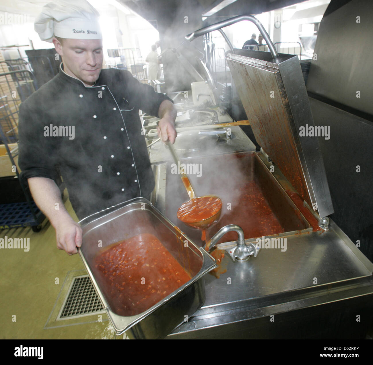 Chef David Knopp Portions Tomato Sauce In Vast Kitchen Alex Menue Chef David Knopp Portions Tomato Sauce In Vast Kitchen Alex Menue