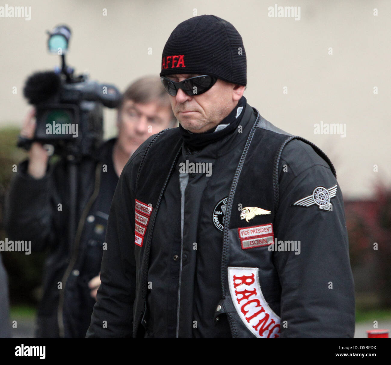 A member of the motorcycle club 'Hell's Angels' stands in line in Stock