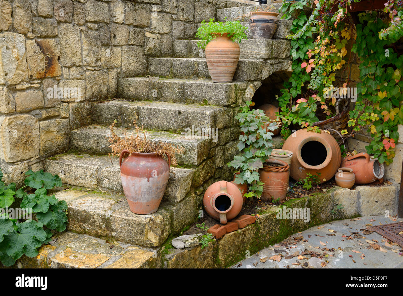 Terracotta Flowerpots On An Outdoor Stone Staircase In Rustic Hillside Town Of Yesilyurt Malatya Turkey Terracotta Flowerpots On An Outdoor Stone Staircase In Rustic Hillside Town Of Yesilyurt Malatya Turkey