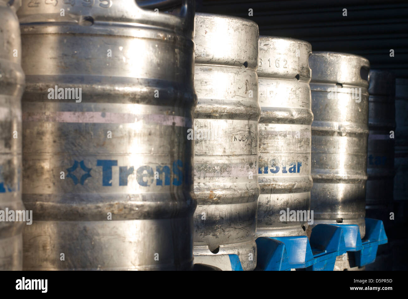 Stacked beer kegs in brewery yard Stock Photo, Royalty Free Image