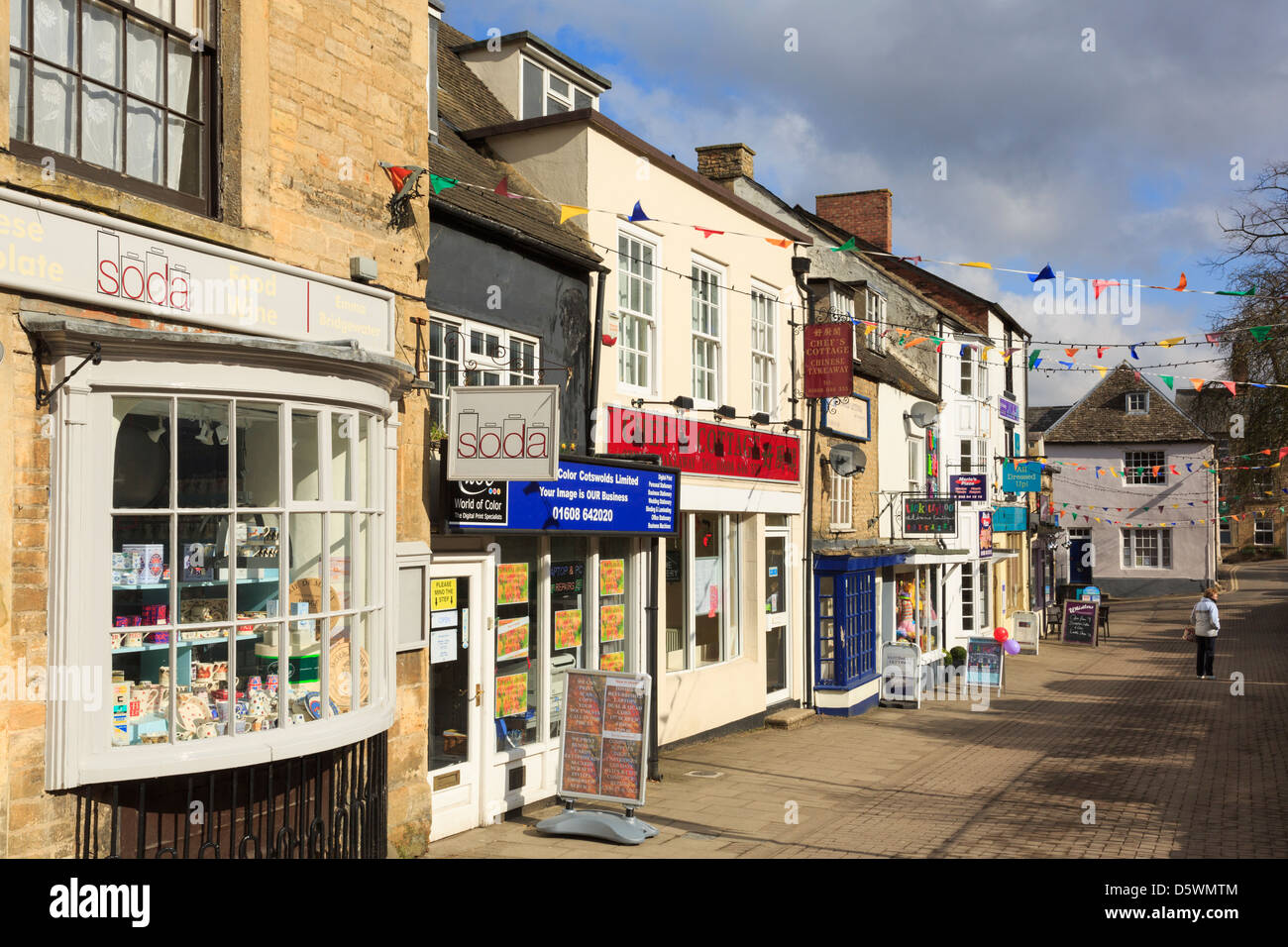 Quaint shops in the old Cotswold town centre in Chipping Norton Stock