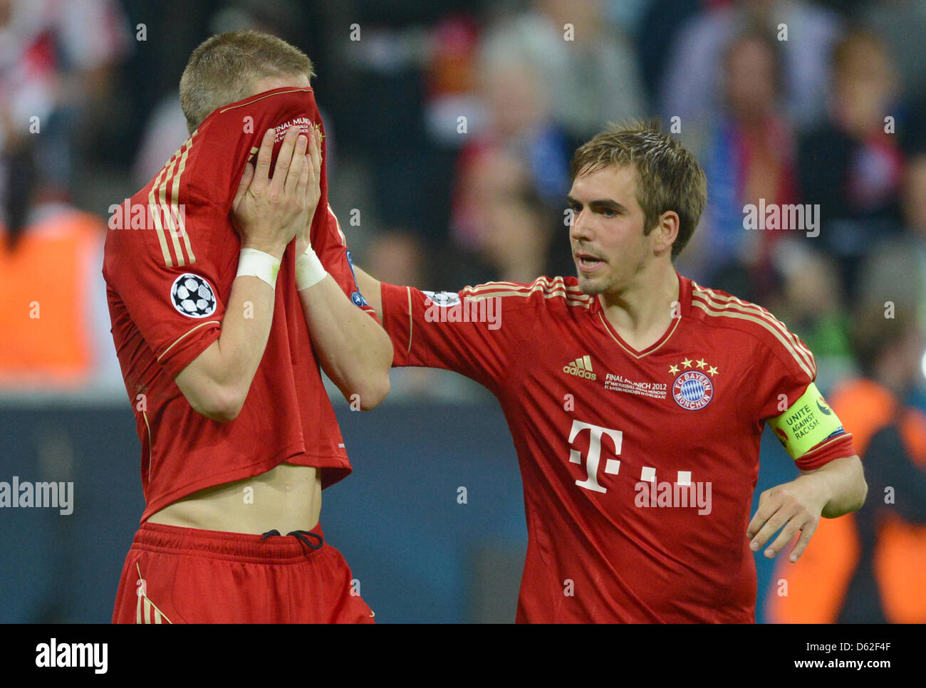 Munich's players Bastian Schweinsteiger (L) and Philipp Lahm look Stock