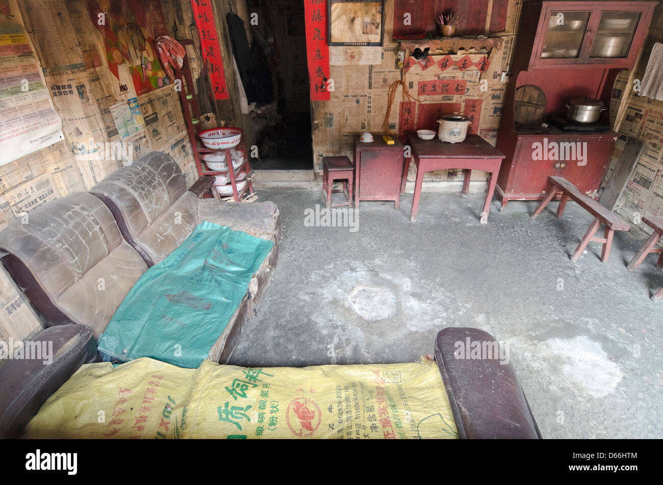 Living Room With Newspaper Wallpaper In Zengchong Dong Village In Living Room With Newspaper Wallpaper In Zengchong Dong Village In