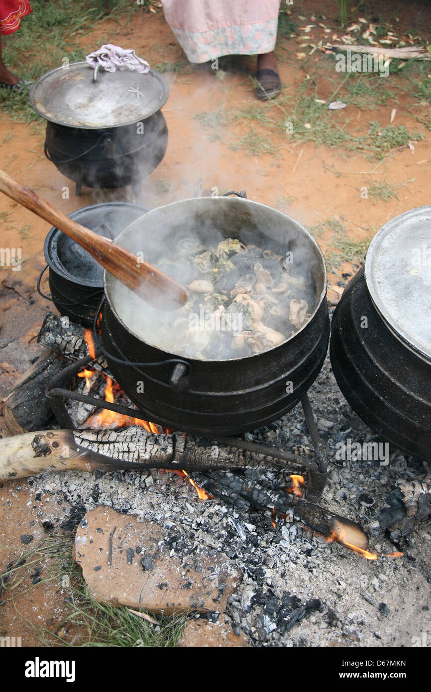 Cooking in a large pot, outside Stockfoto, Lizenzfreies Bild 55488937