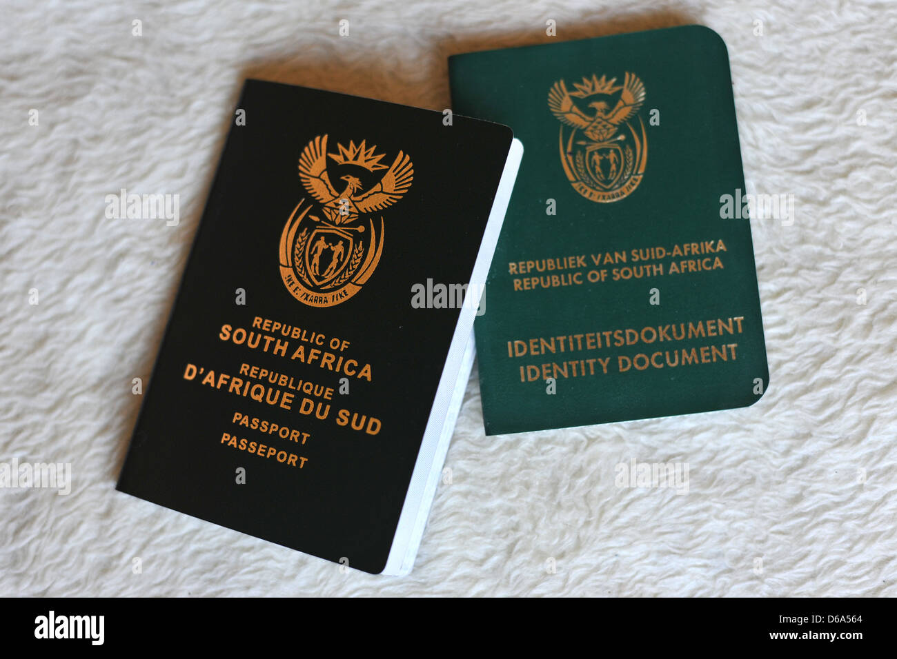 A new South African passport next to a South African Identity Stock