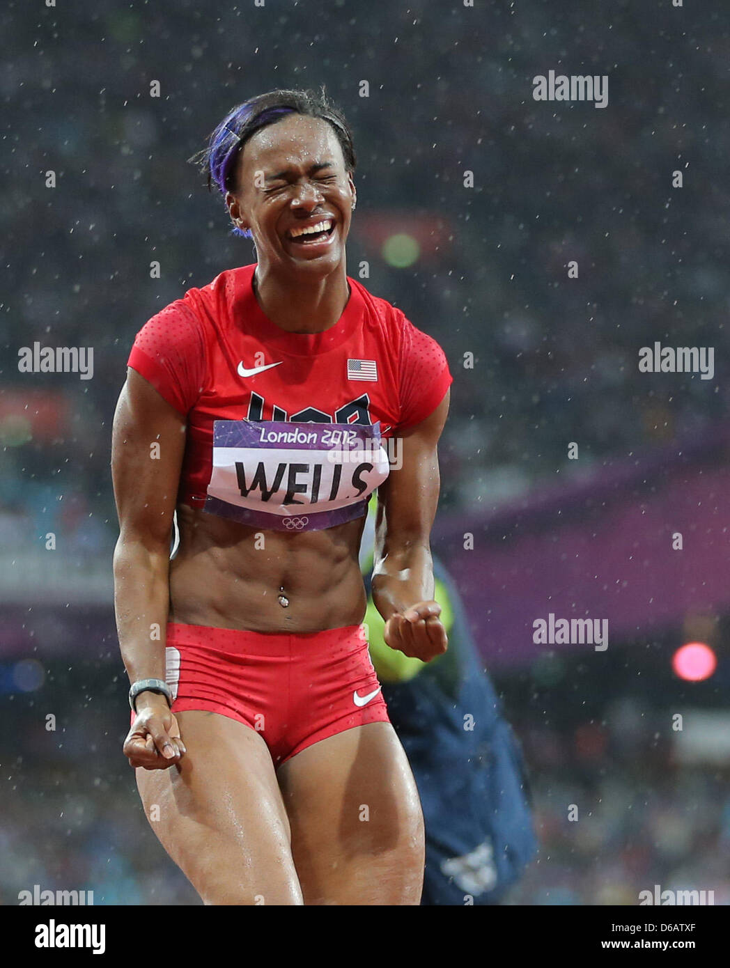 Kellie Wells Of USA Celebrates After Won Bronze In The 100m Hurdles