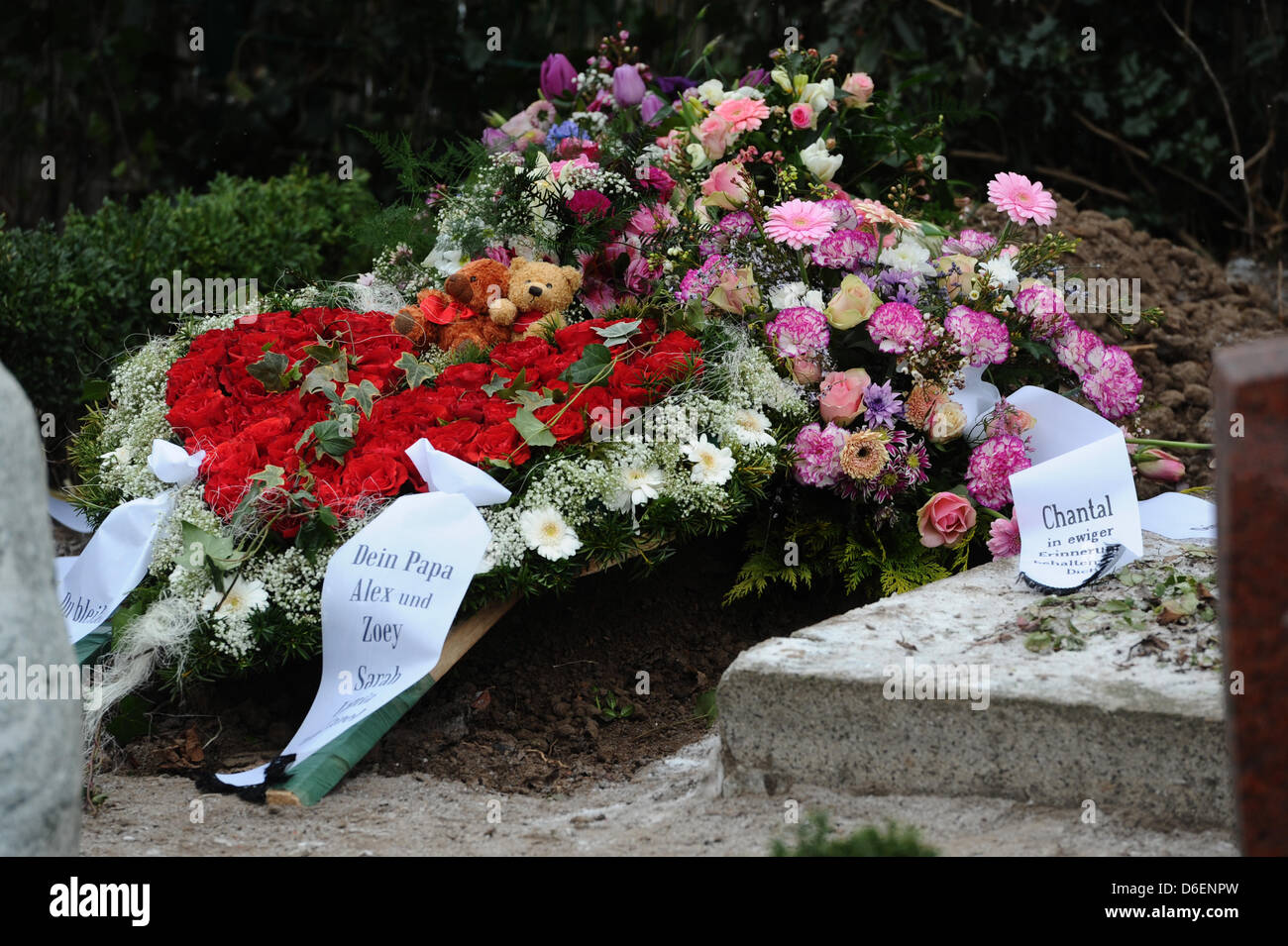 Wreaths and flowers are laid down to the grave of the died eleven Stock