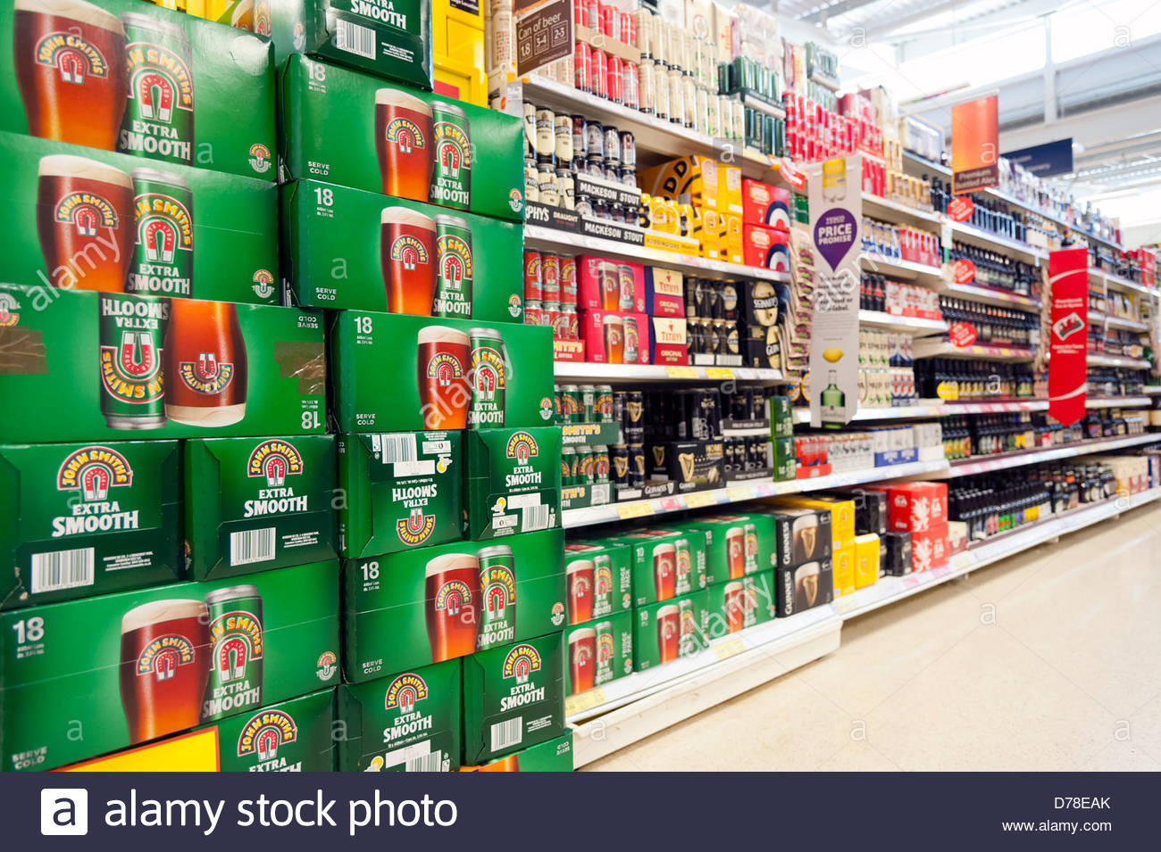 Aisle full of beer for sale in a Tesco store, UK Stock Photo, Royalty