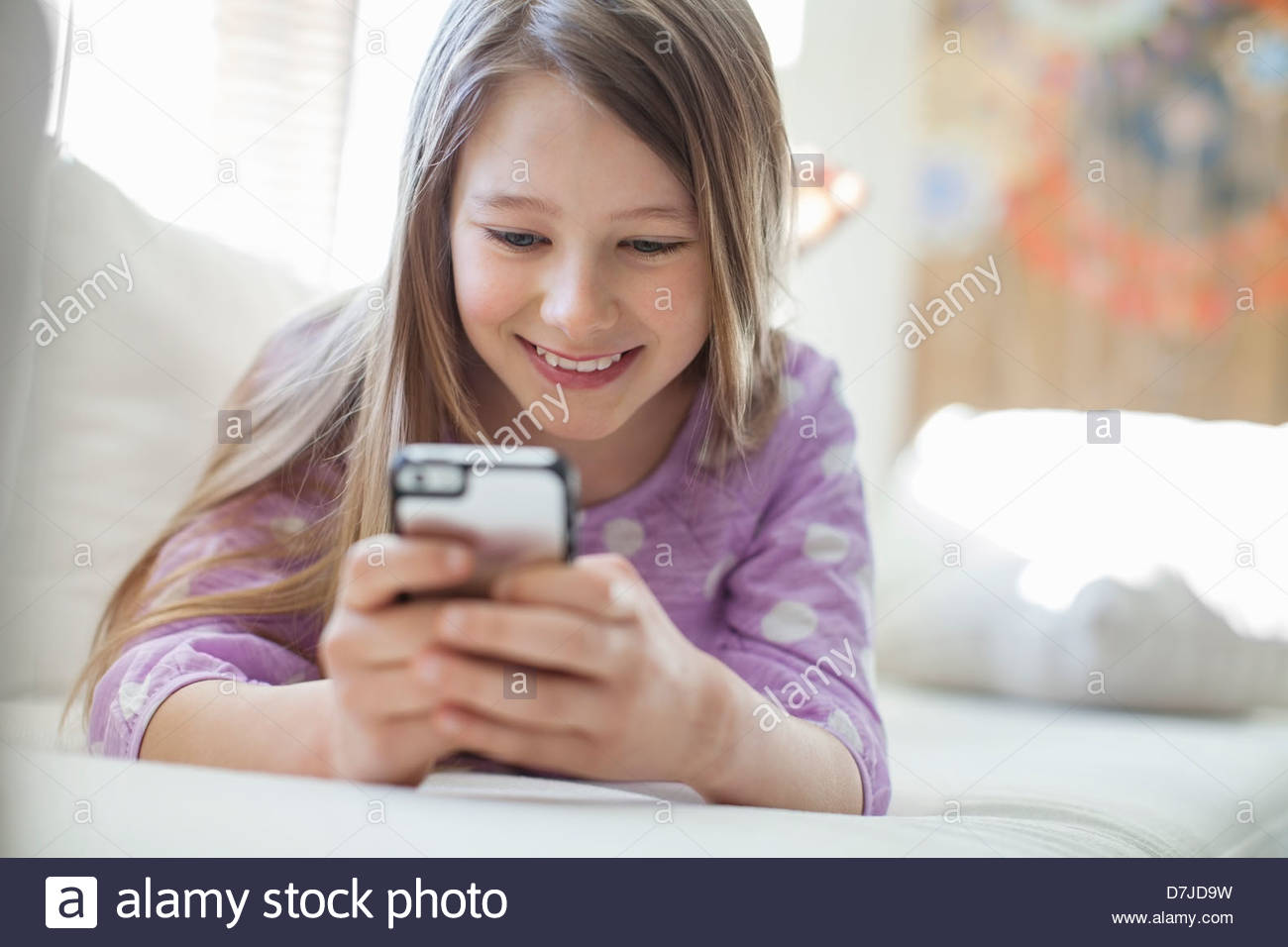 young-girl-text-messaging-with-mobile-ph