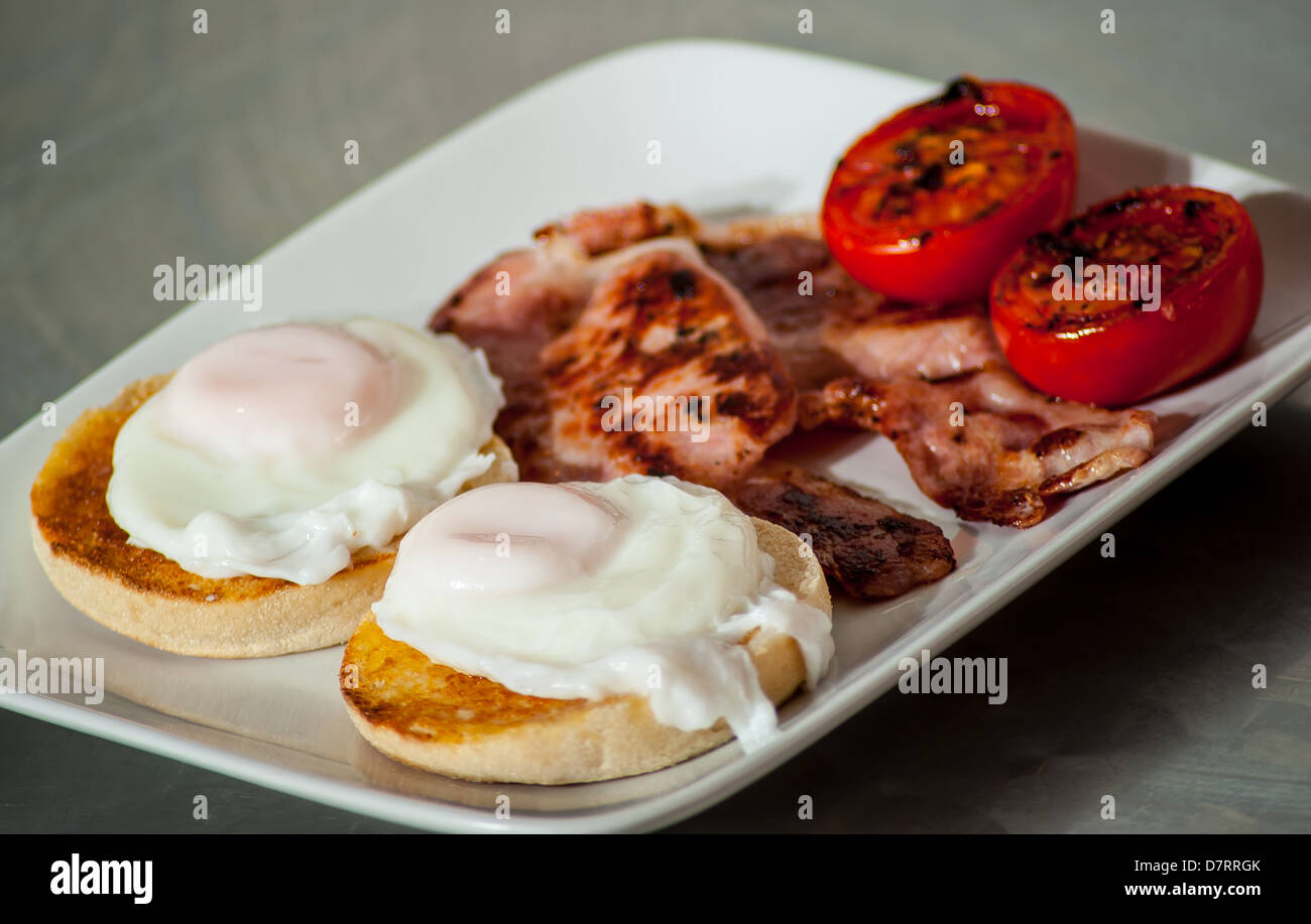 A healthy English breakfast - 2 poached eggs on muffins ...