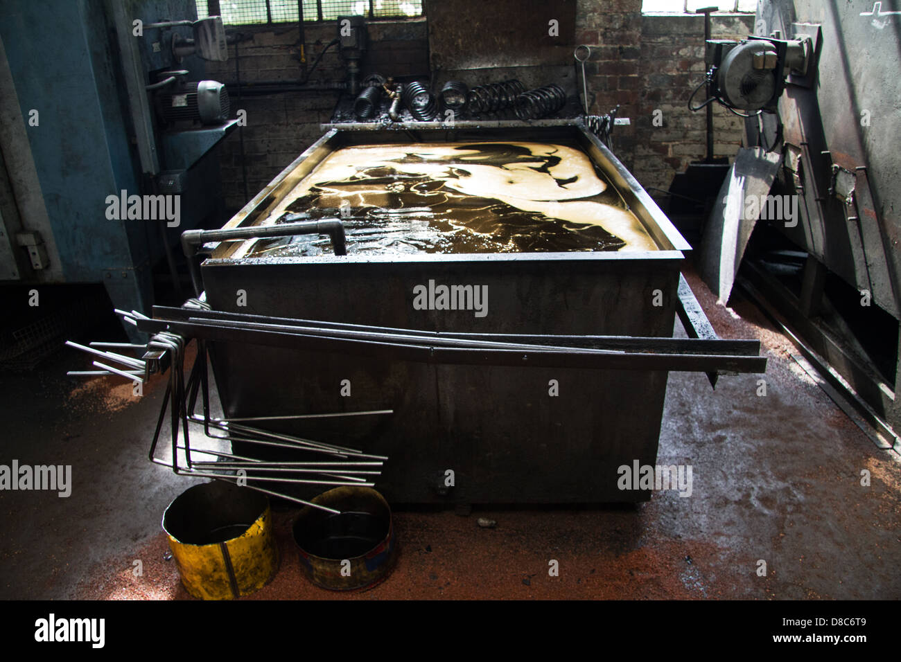 Oil quenching bath used in the production of steel coil suspension