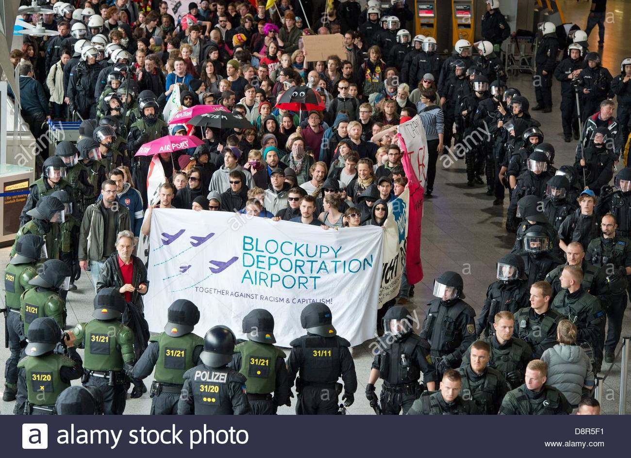 epa03725318-blockupy-movement-activists-are-surrounded-by-police-as-D8R5F1.jpg