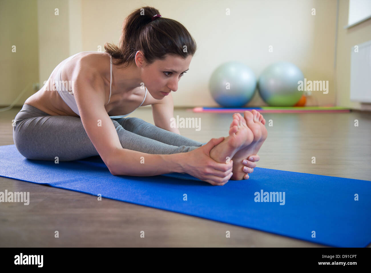 Young Pretty Girl Stretching Legs Yoga Workout Young Pretty Girl Stretching Legs Yoga Workout
