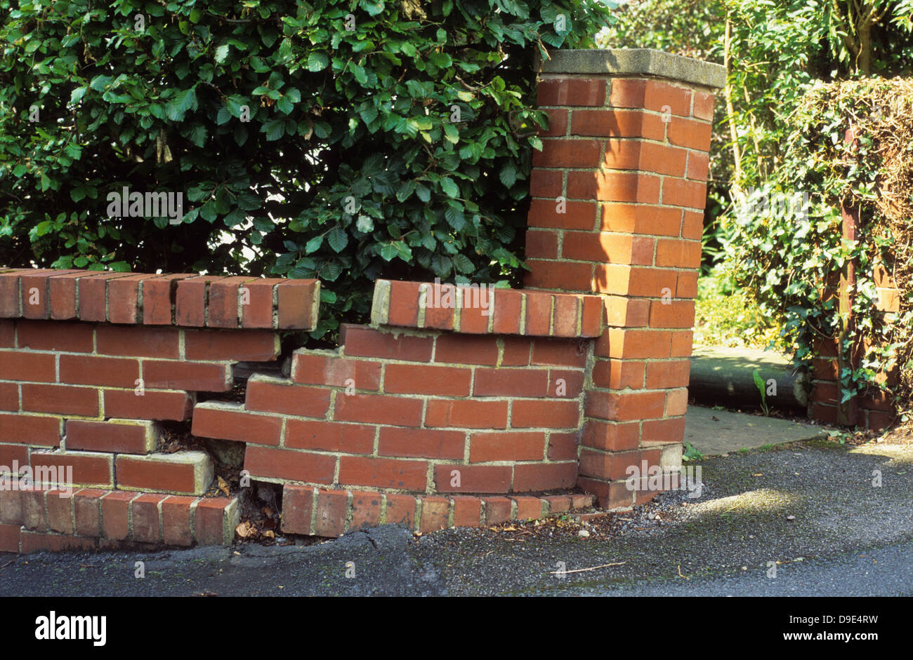 subsidence on brick wall falling down Stock Photo, Royalty Free Image