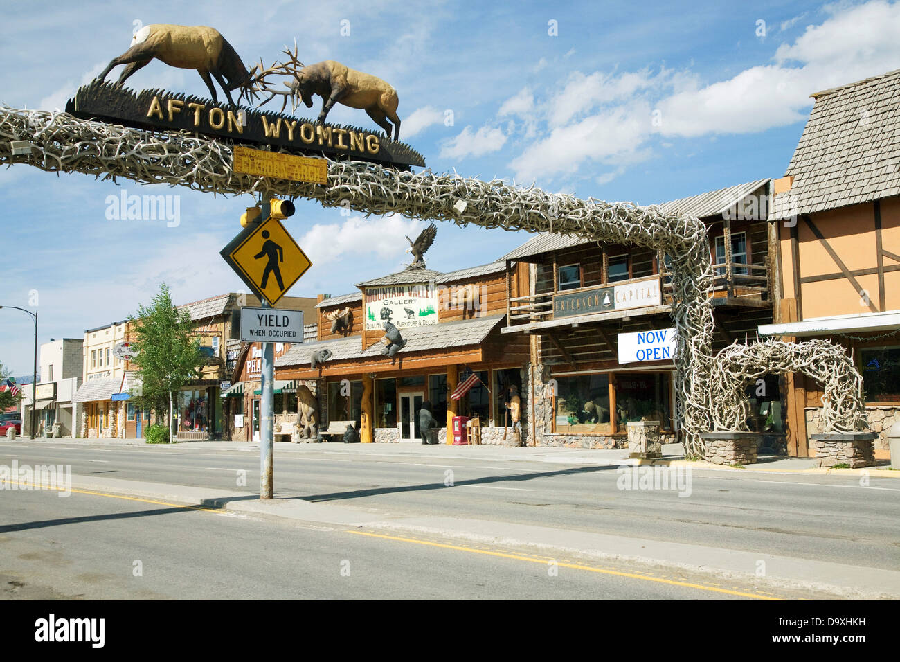 Elk displayed over Main Street storefronts, Afton, Wyoming Stock Photo