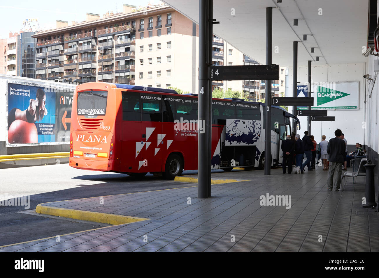 passengers disembarking public bus in bus station in tarragona Stock