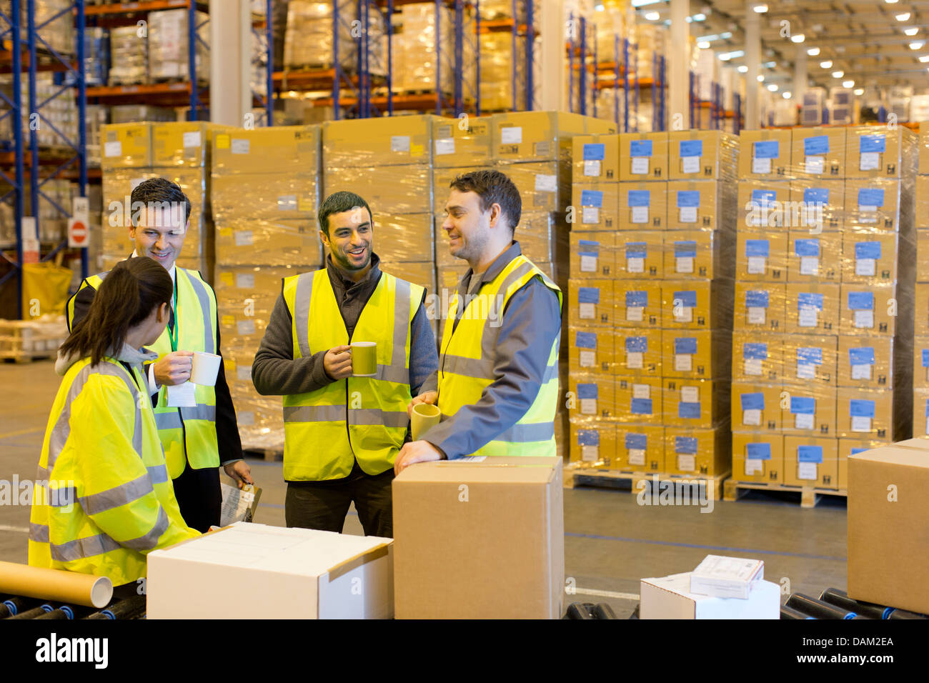 Workers drinking coffee in warehouse Stock Photo 58218674 Alamy