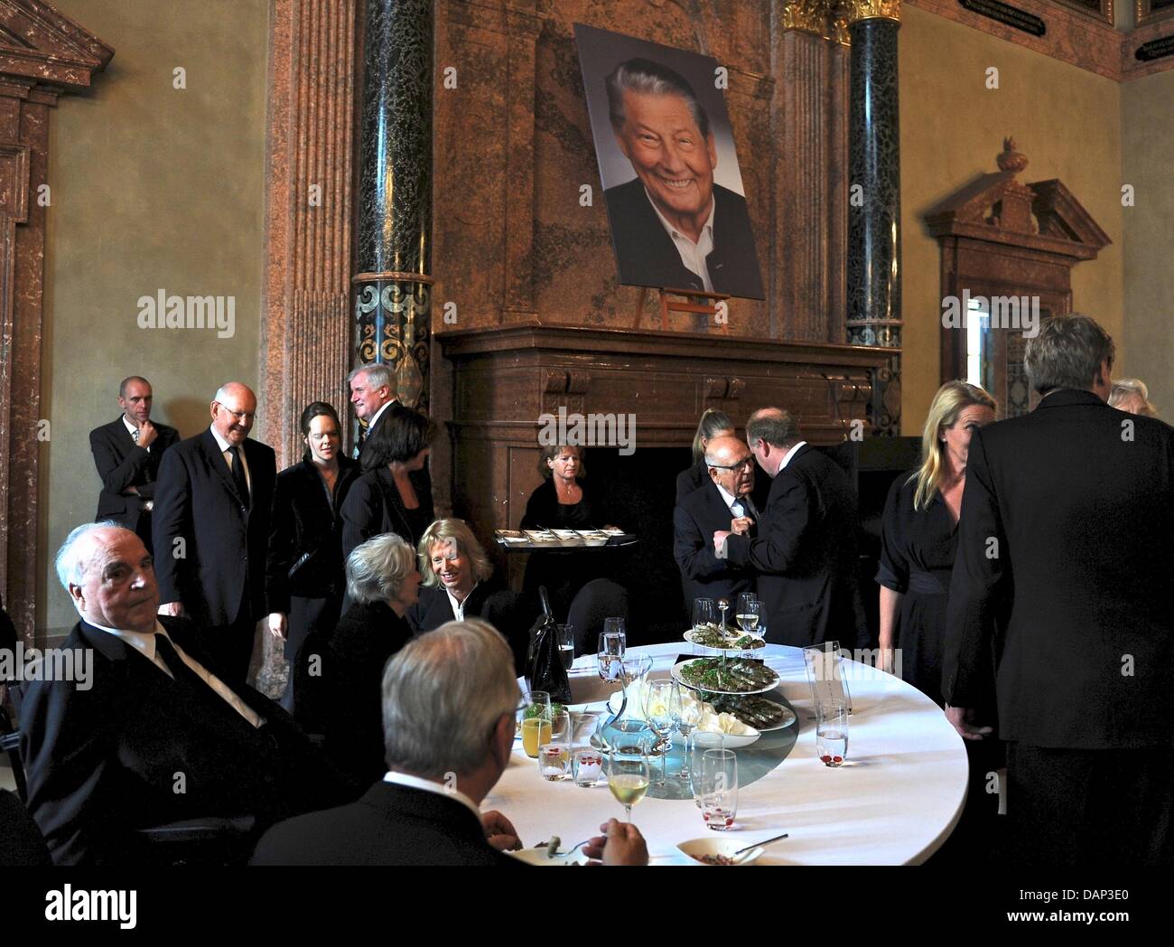 Funeral guests take part in the reception after the funeral service