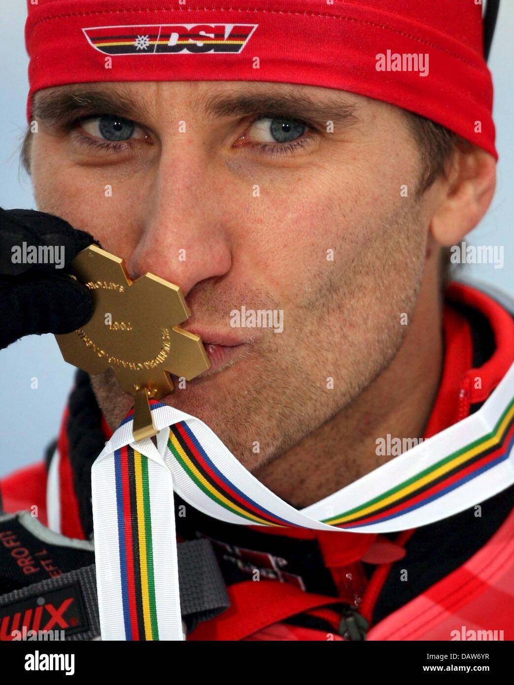 Download preview image - nordic-combiner-ronny-ackermann-of-germany-kisses-his-gold-medal-conquered-DAW6YR